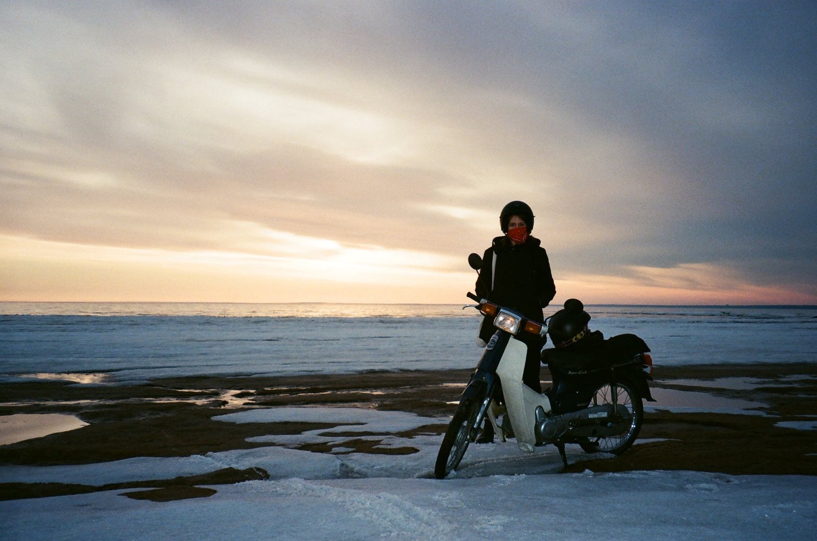 woman standing near motorcycle